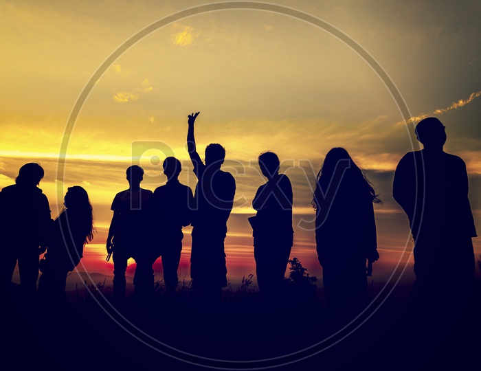 Silhouette group of Young  people at sunset