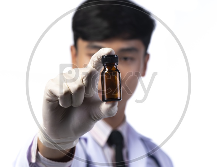 Asian Doctor Holding Injection Bottle in Hand Isolated on White Background