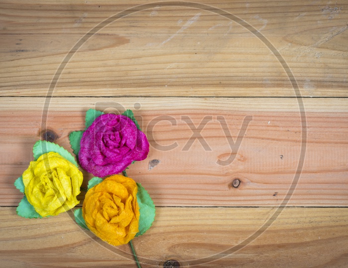 Colourful Flowers over Wooden background With Spacing