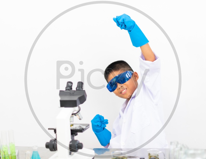 Asian Child Scientist with Protective Glasswear at Laboratory