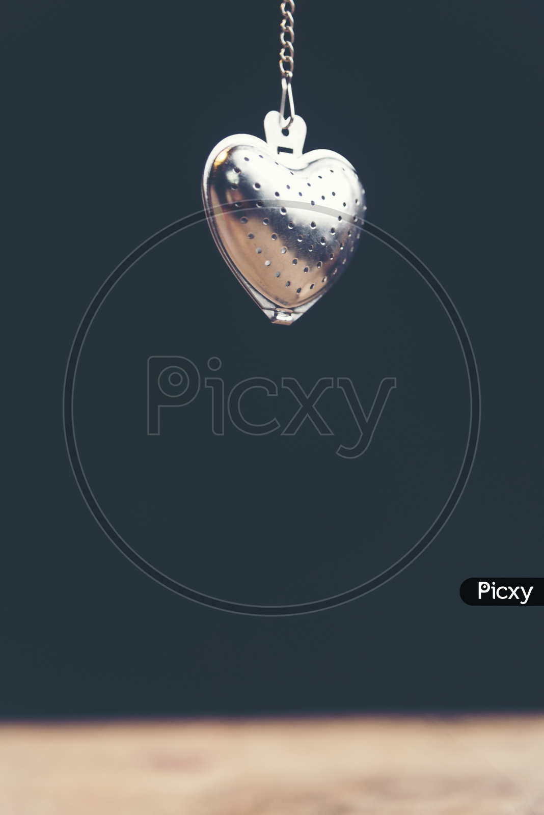 Heart shaped stainless steel locket with black background