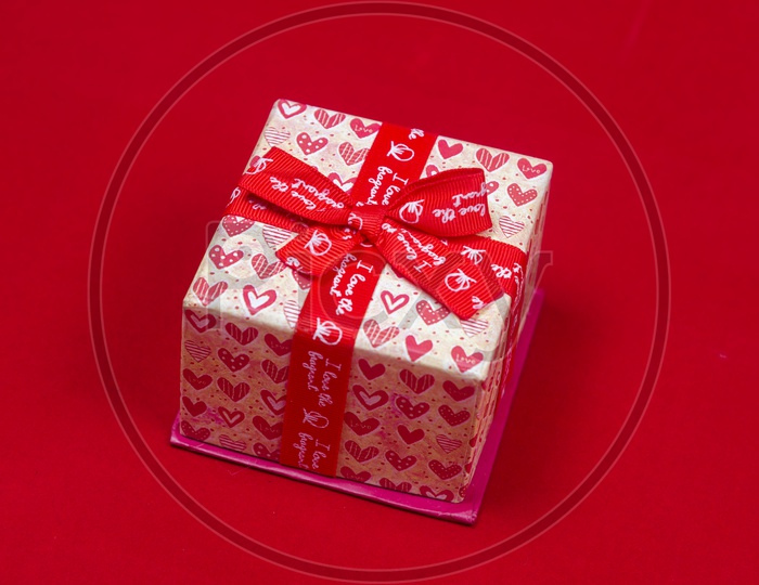 Gift box with red background - abstract picture for Valentine day, vintage filter image