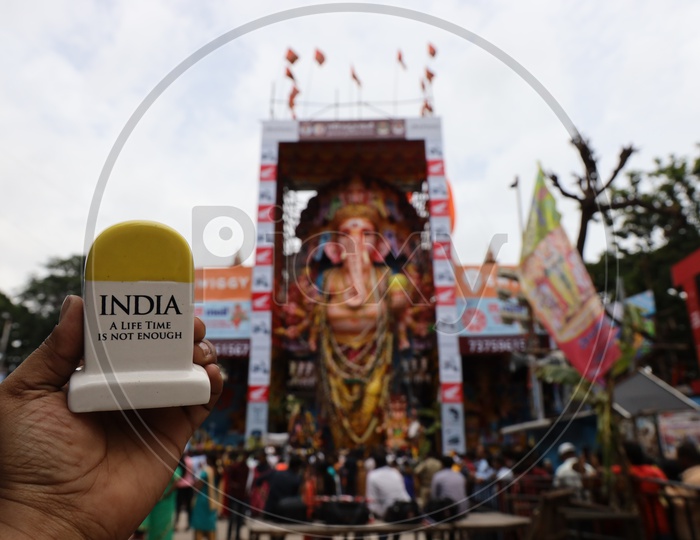 India  A Lifetime Not Enough  Mile Stone Miniature With Khairatabad Ganesh Idol In Background