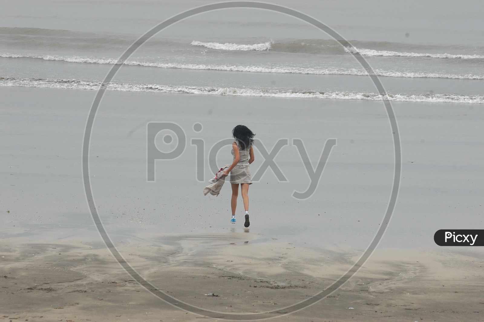 A girl running at the beach