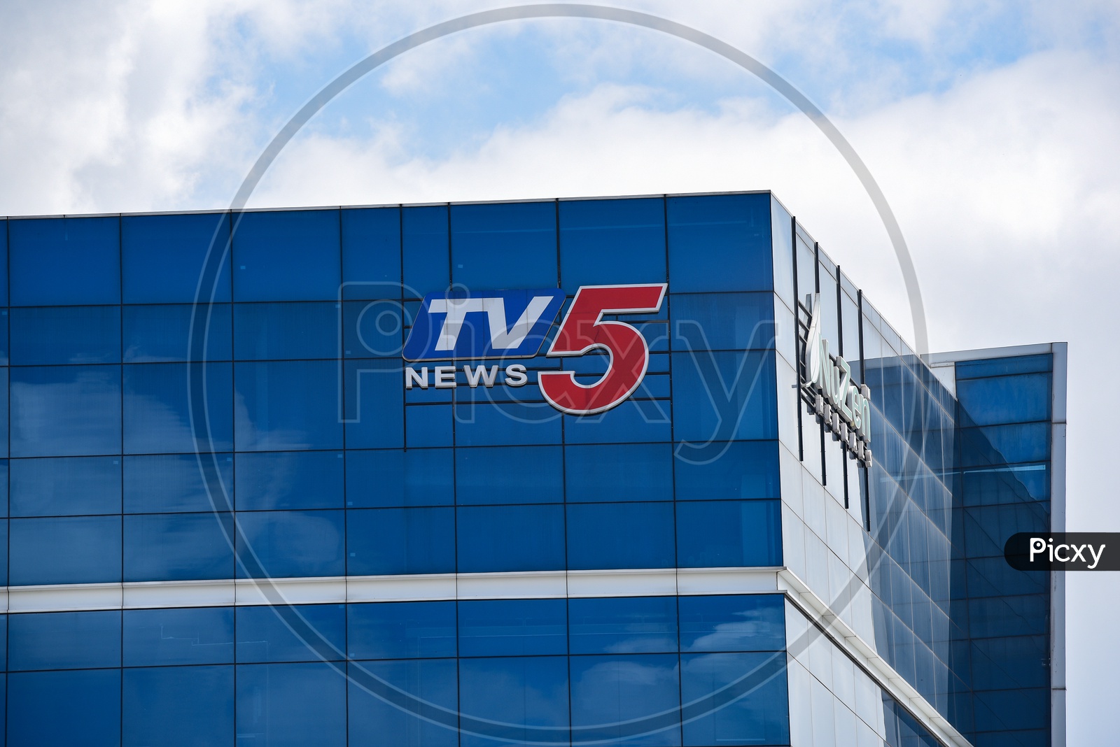 TV5 News Name on Building Facade
