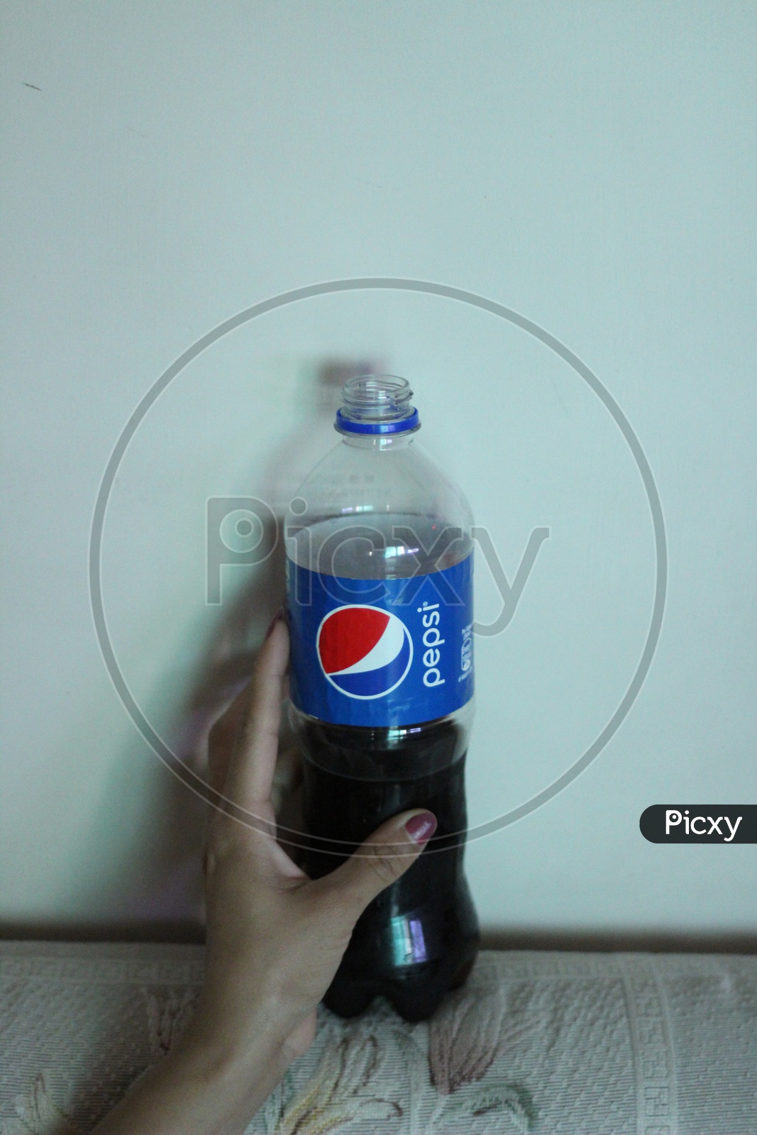 Pepsi Soft Drink or cool Drink Pet Bottle holding in Hand