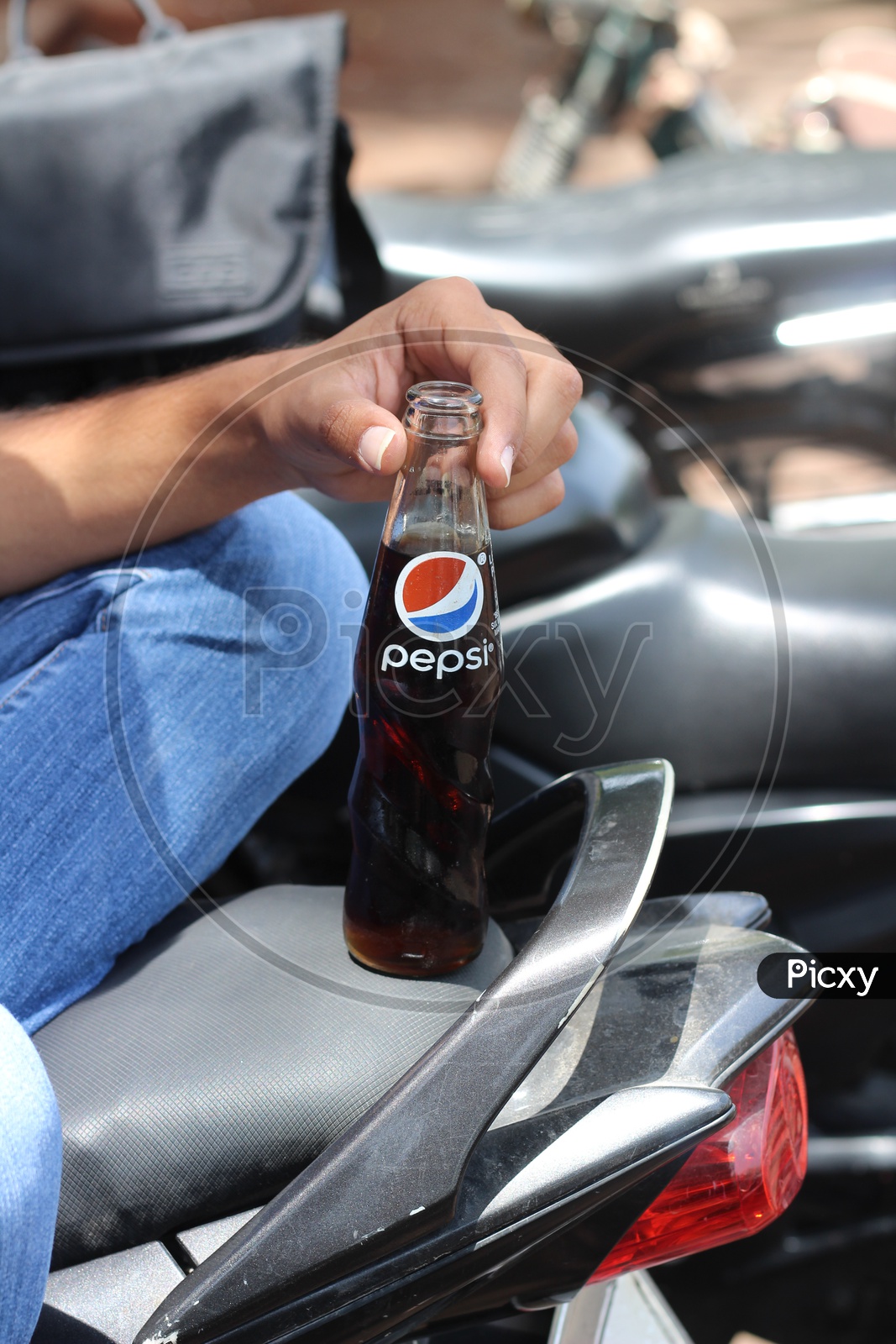 Pepsi Soft Drink or cool Drink Bottle holding in Hand