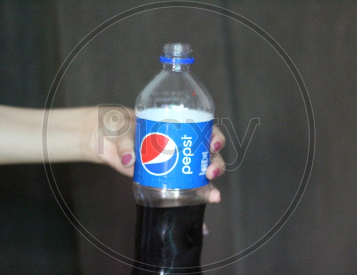 Pepsi Soft Drink or cool Drink Pet Bottle holding in Hand