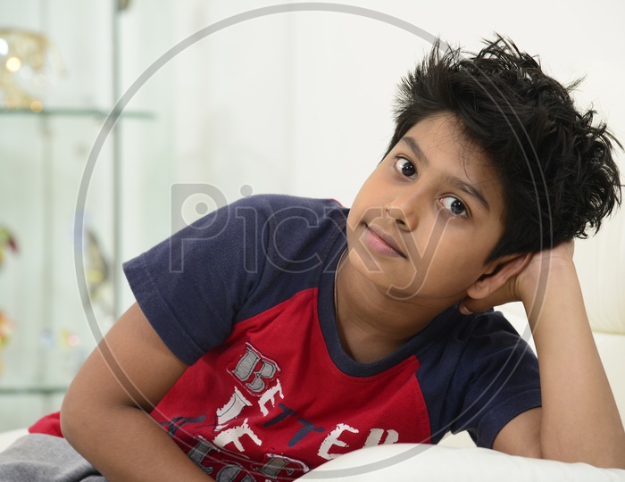 Indian little boy posing with a funky hairstyle