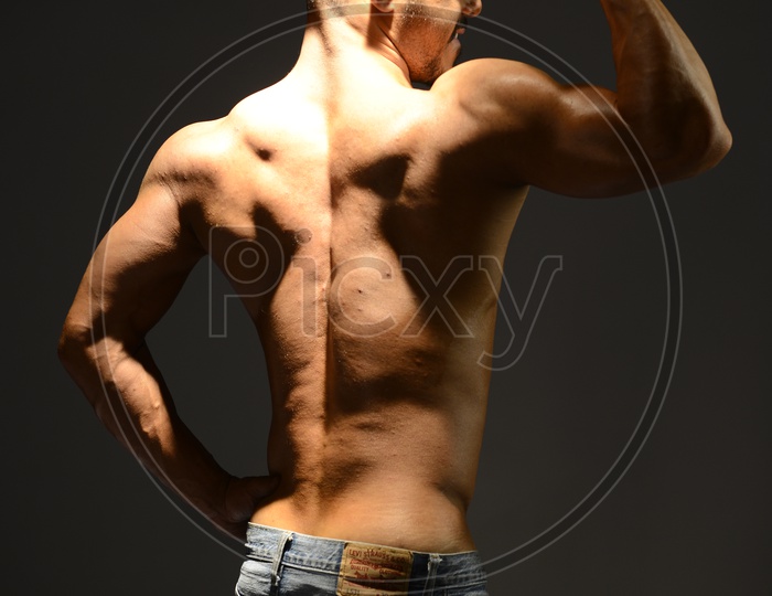 Indian Young Male with Bare chested showing Six Pack