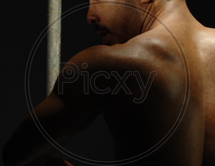 Indian Muscular Man showing his back