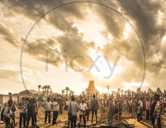 People capturing and watching lord ganesha nimarjan at pattinapakkam beach