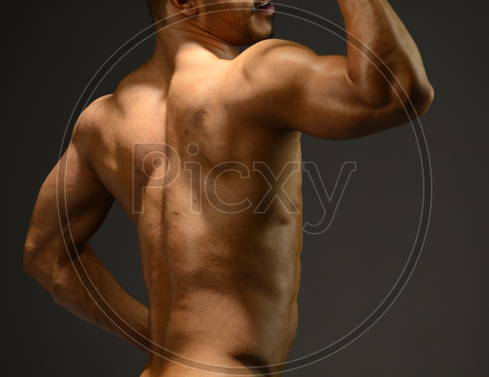 Young Indian Male with Bare chested showing Six Pack