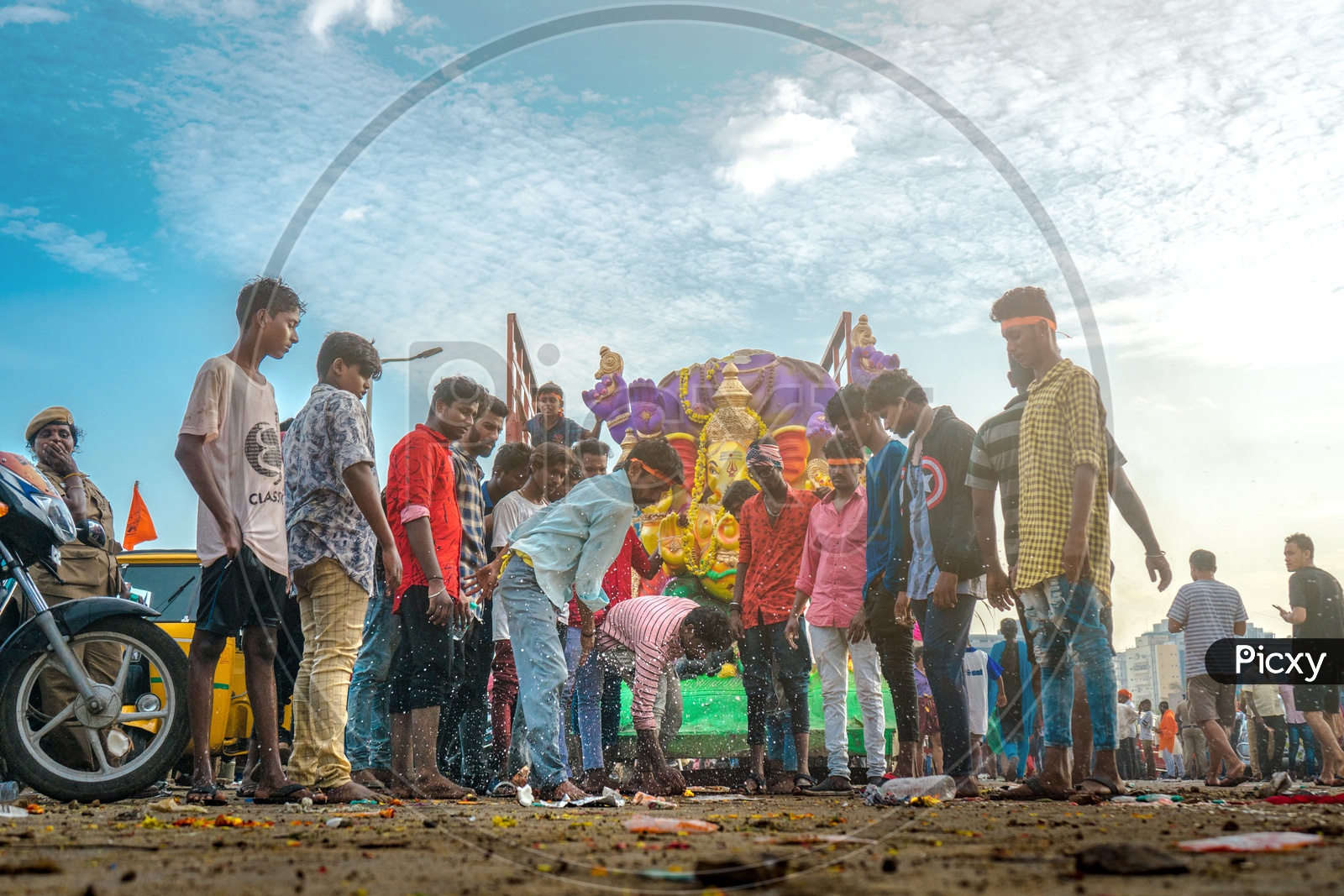 People offering coconut to lord ganesha during nimarjan.