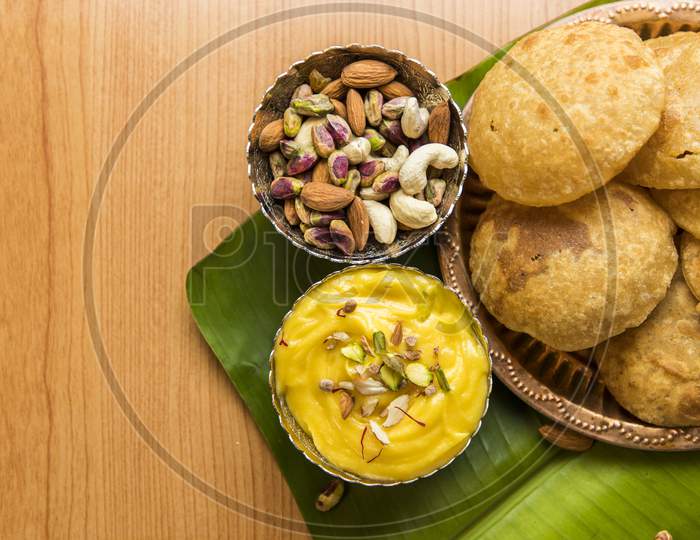 Traditional Food For Marati New Year  Gudipadwa  Aam Panna And Puri Served Over Banana Leaf Background