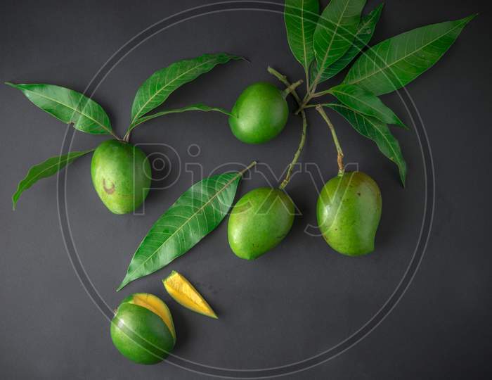 Raw Mango Over an Isolated Back Background