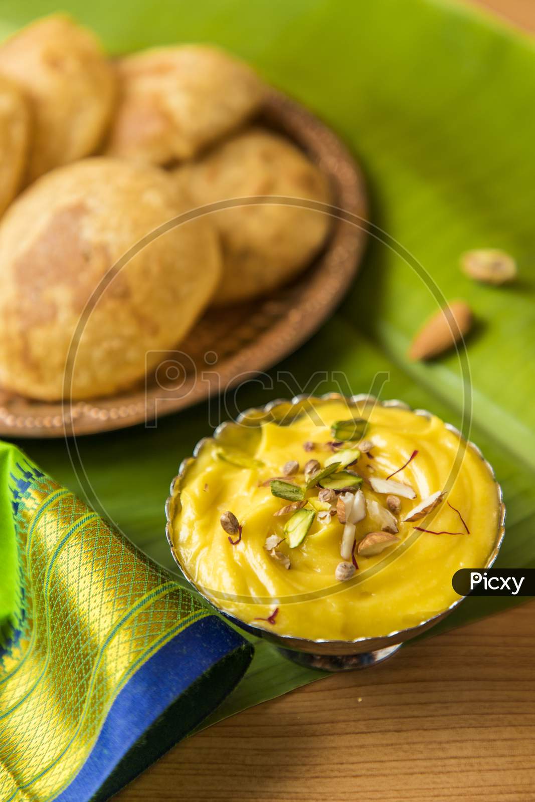 Traditional Food For Marati New Year  Gudipadwa  Aam Panna And Puri Served Over Banana Leaf Background