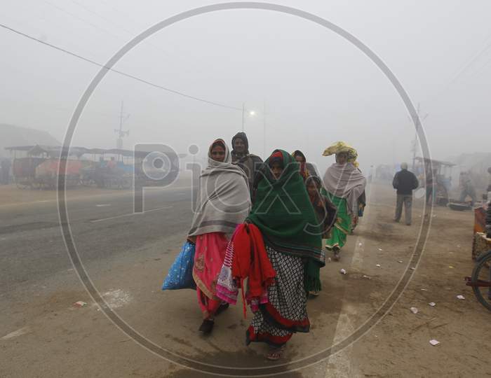 Devotees In Foggy Winter Mornings  in Prayagraj , Allahabad