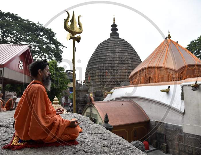 Hindu Holy Men Perform Yoga To Mark International Yoga Day At Kamakhya Temple In Guwahati In The Indian State Of Assam