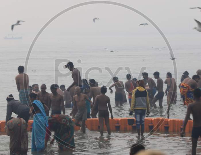 Crowd Of Hindu Devotees Taking Holi Dip In River Triveni Sangam At Prayagraj During  Ardh Kumbh Mela 2019