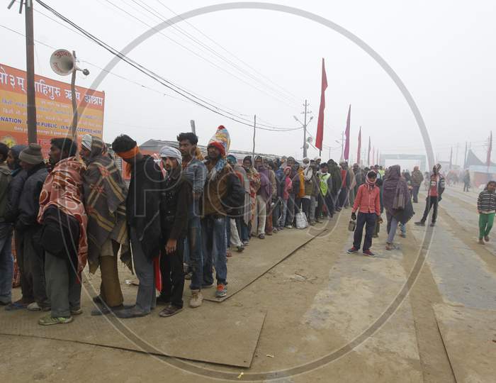 Devotees Waiting In Queue Lines At Food Donation Stalls in Kumbh Mela At Prayagraj, Allahabad