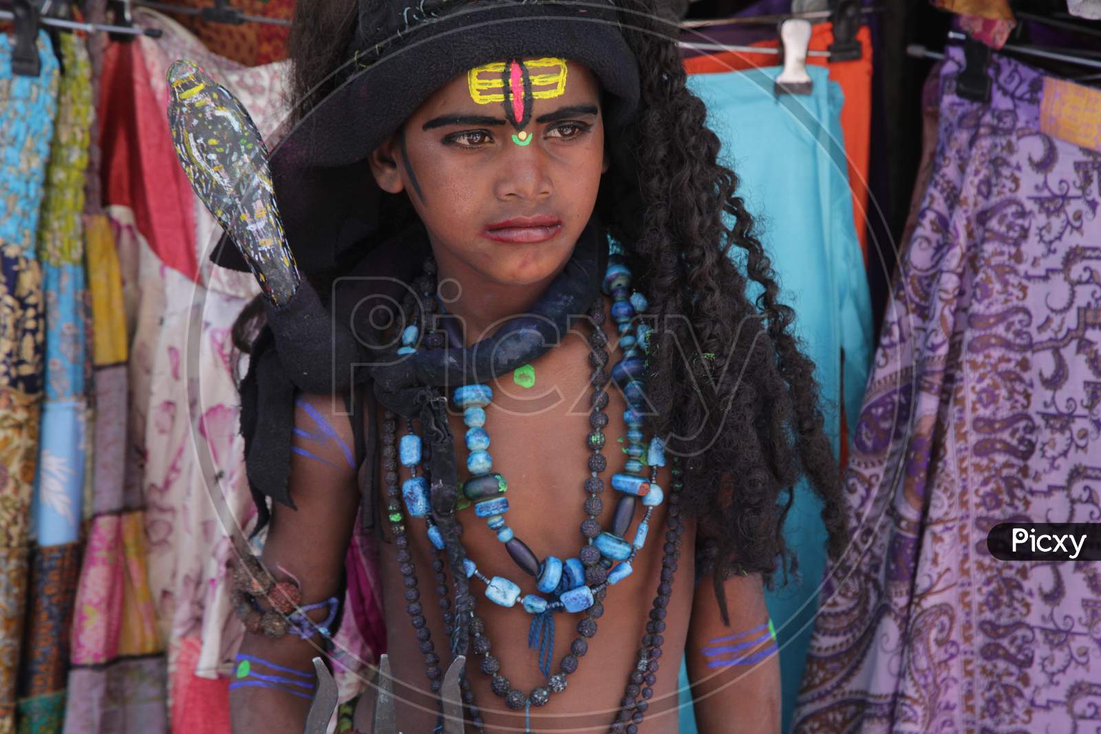 Indian boy dressed up as Lord Shiva