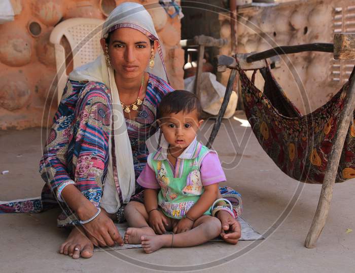 Rajasthani mother with his child