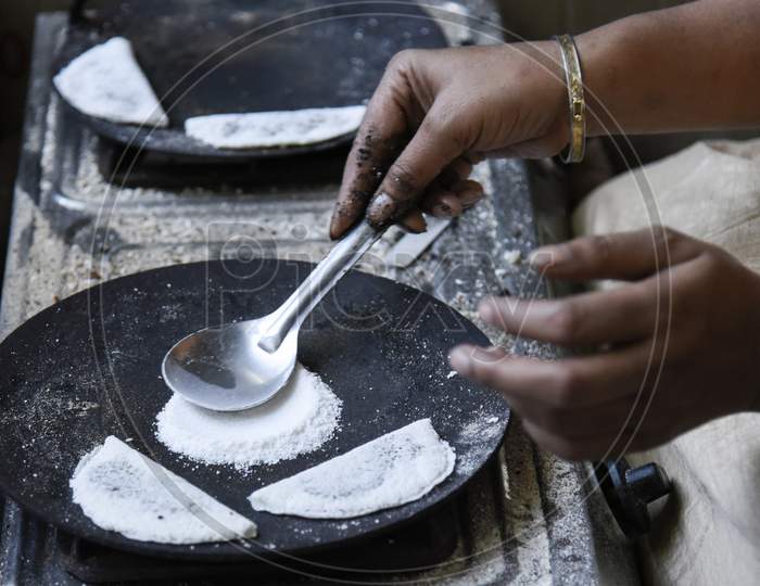 Assamese Woman Prepares Traditional Food, Pitha, Ahead Of Bhogali Bihu Or Magh Bihu, In Guwahati,