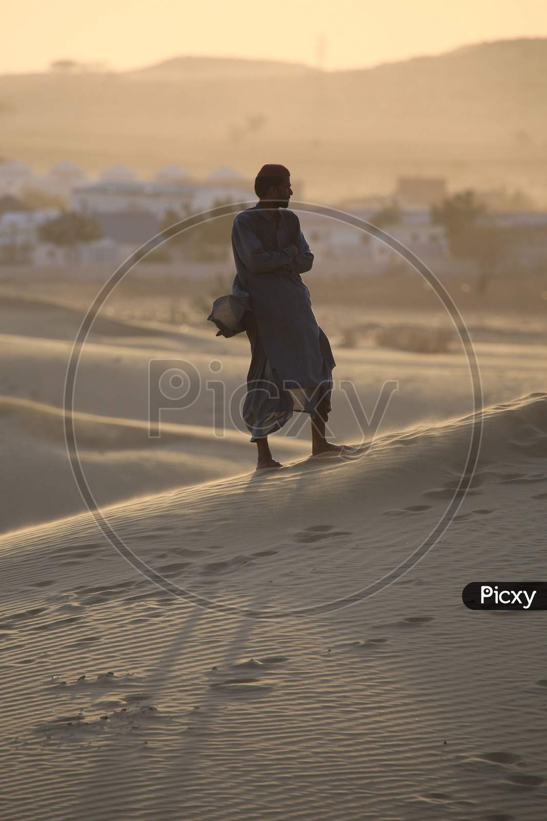 A Rajasthani man standing on the desert