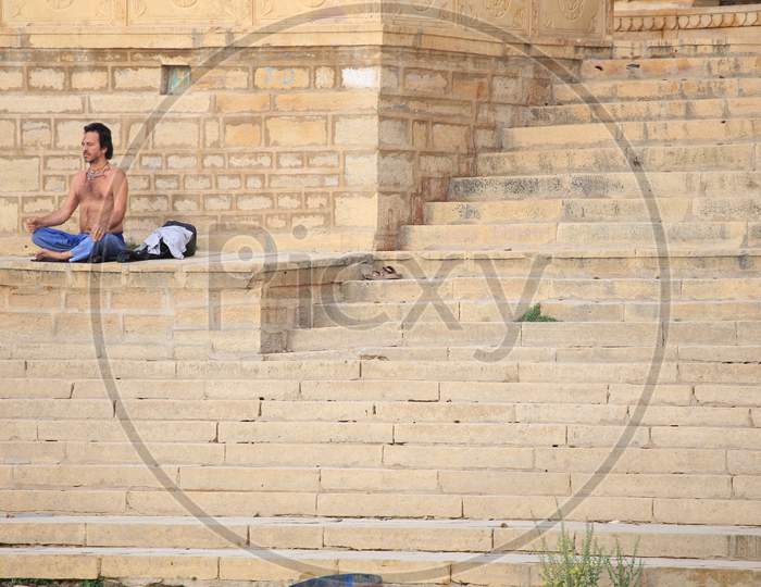 A Man Doing Yoga on Ghat at Jaisalmer