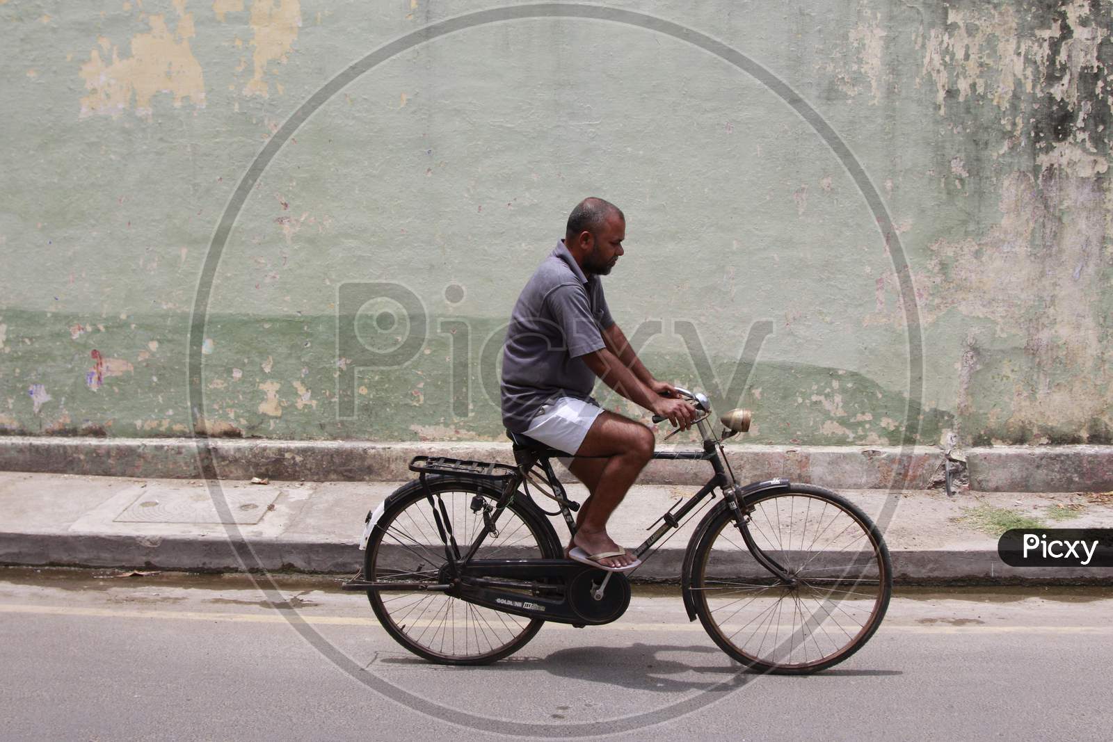 A Man on Bicycle