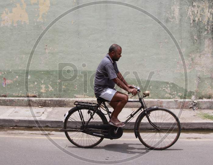 A Man on Bicycle