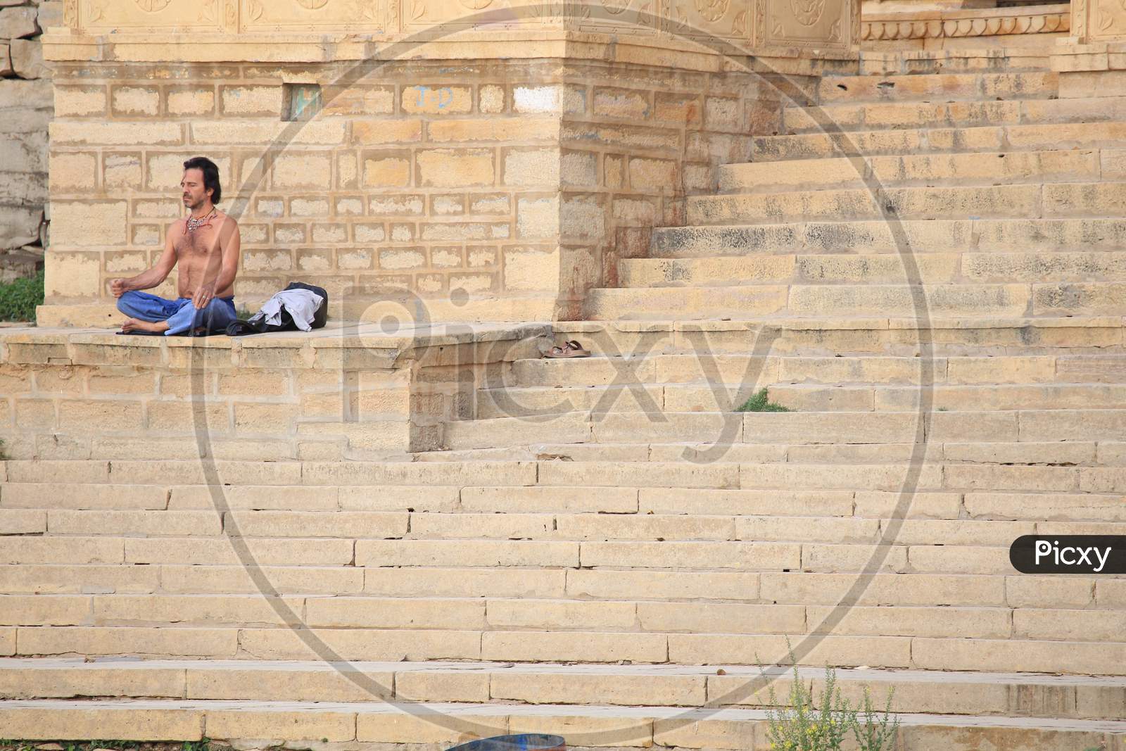 A Man Doing Yoga on Ghat at Jaisalmer