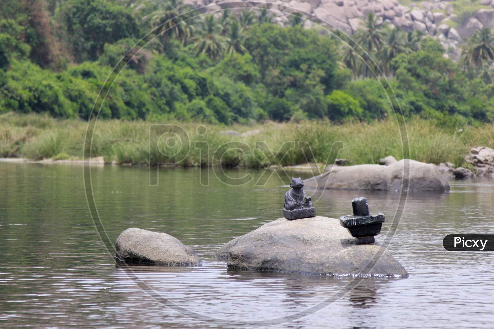 Sivalingam and Nandi Statue on the rocks