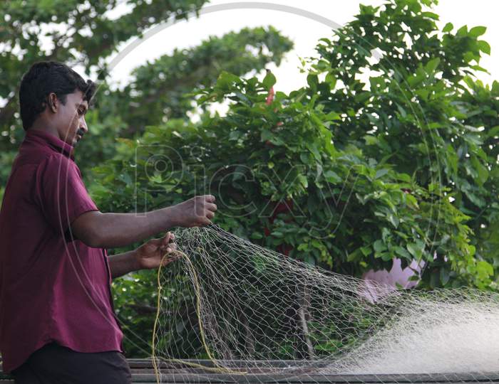 Indian Fisherman with a cast net