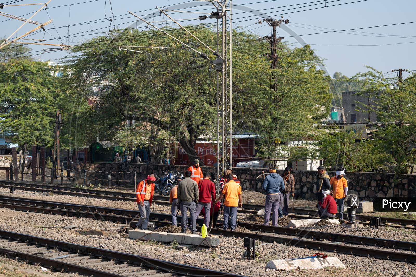 Workers working on railway tracks