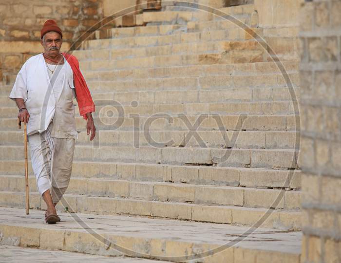 Rajasthani Old Man Walking on the Streets of Jaisalmer