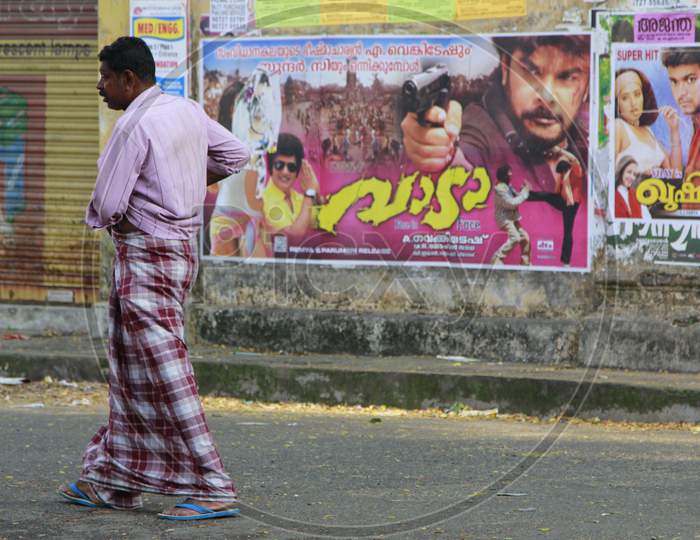 Indian Man walking with a lungi