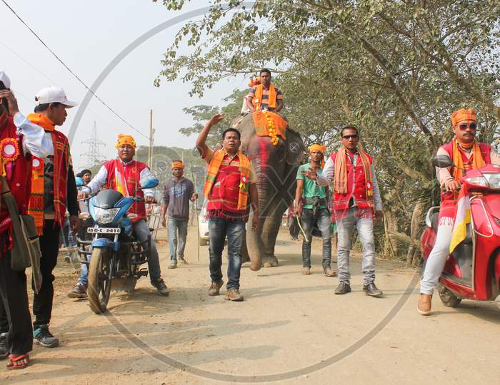 A Man Riding On Elephant As Procession During Bihu Festival Celebrations in Assam