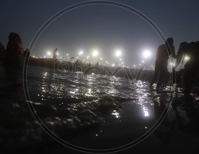 Silhouette of Hindu Priests or Saints  Taking Holy Baths During Magh Mela 2020 At Prayagraj,Allahabad