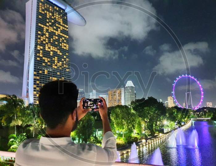 Photographer clicking at Marina bay