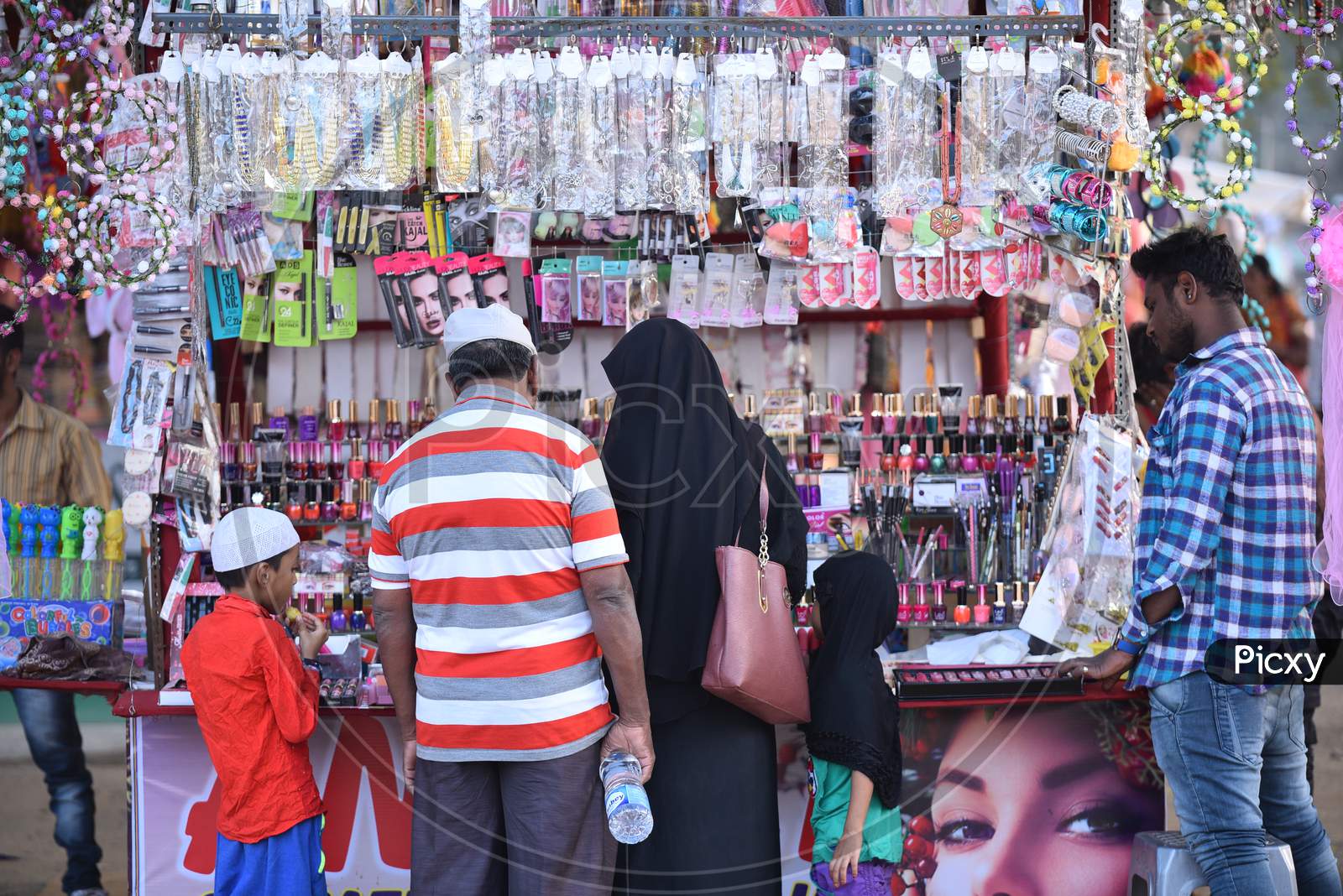 A Muslim Woman Shopping Woman Novelties At a Stall
