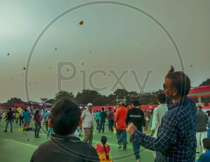 People flying kites at international kite festival paradise