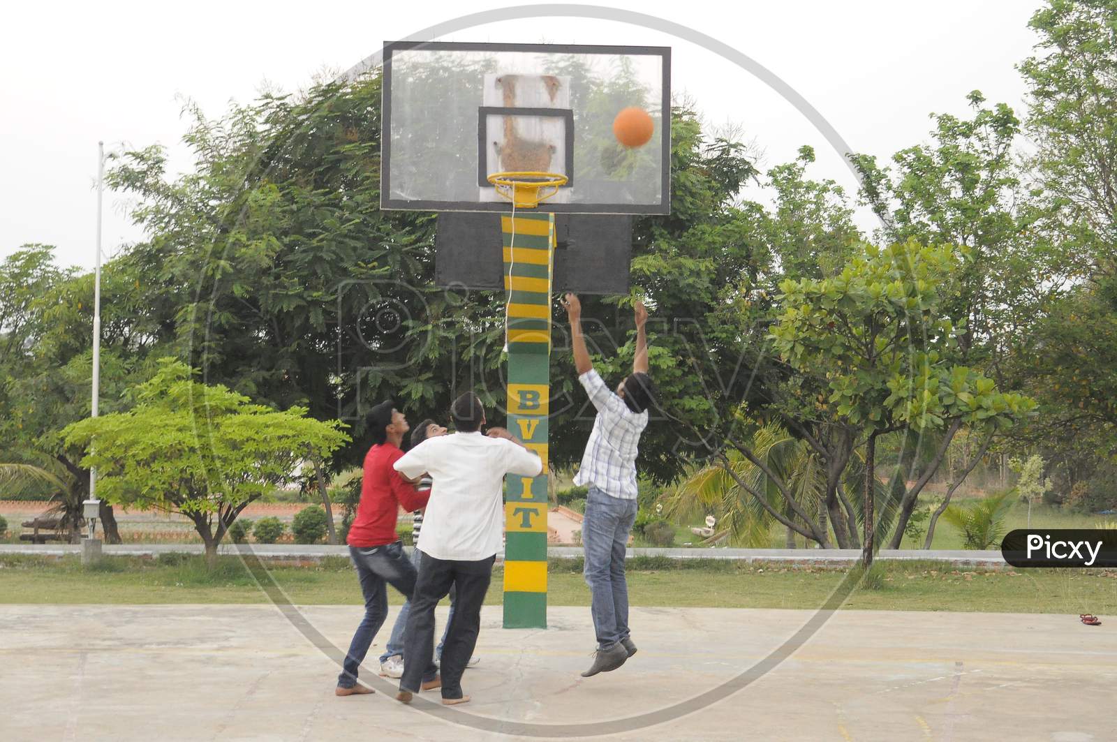 Group of men playing basketball