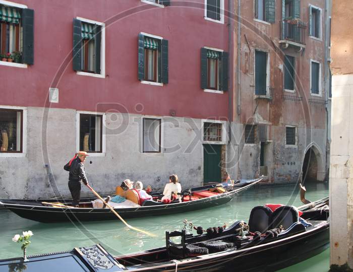 Tourists enjoying Gondola Boat ride
