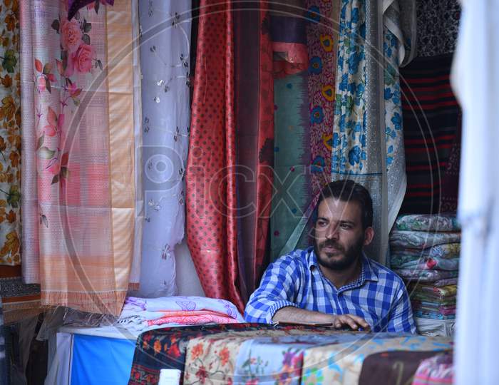 A Kashmiri man waits for customers in his Shawls and dresses Stalls at NUMAISH,Nampally