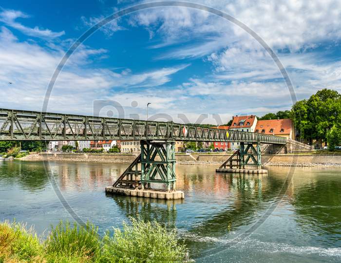 Eiserner Steg Bridge Across The Danube River In Regensburg, Germany