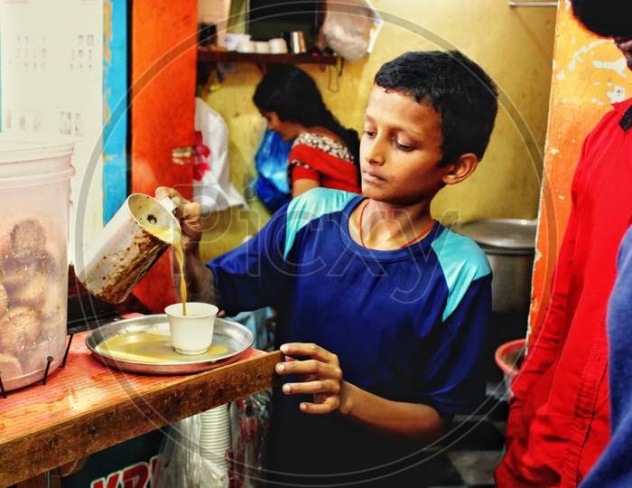 A Boy Preparing Tea in a Shop, Hyderabad