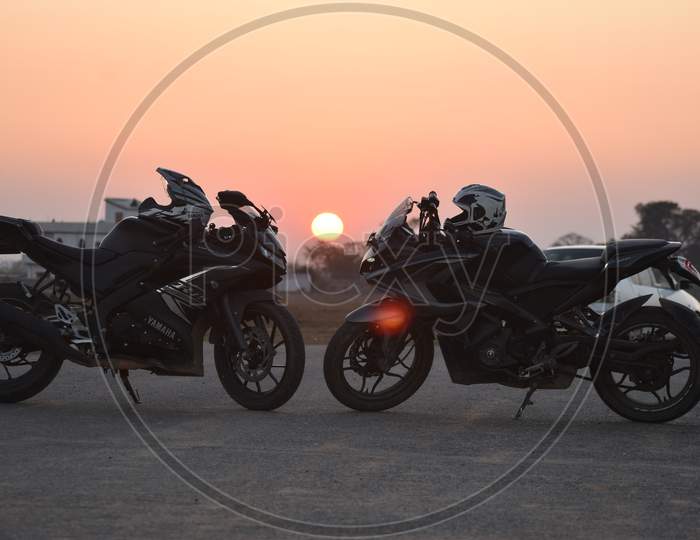 View of Bikes with Sunset in Background