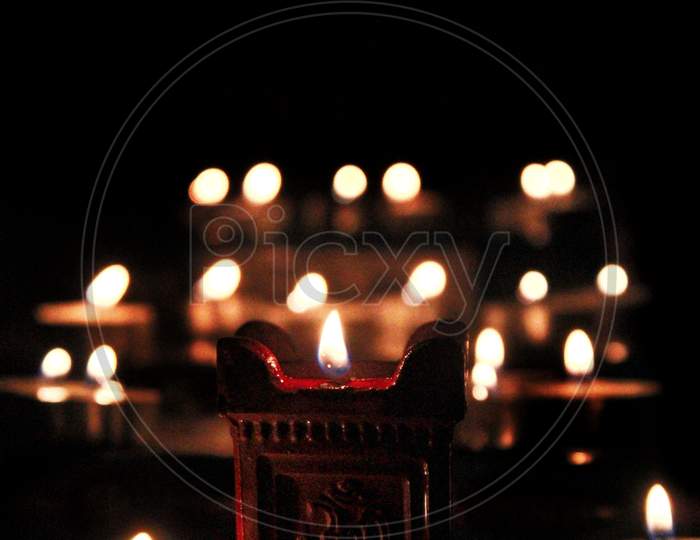 Diwali Dias Lighted Over Dark Background